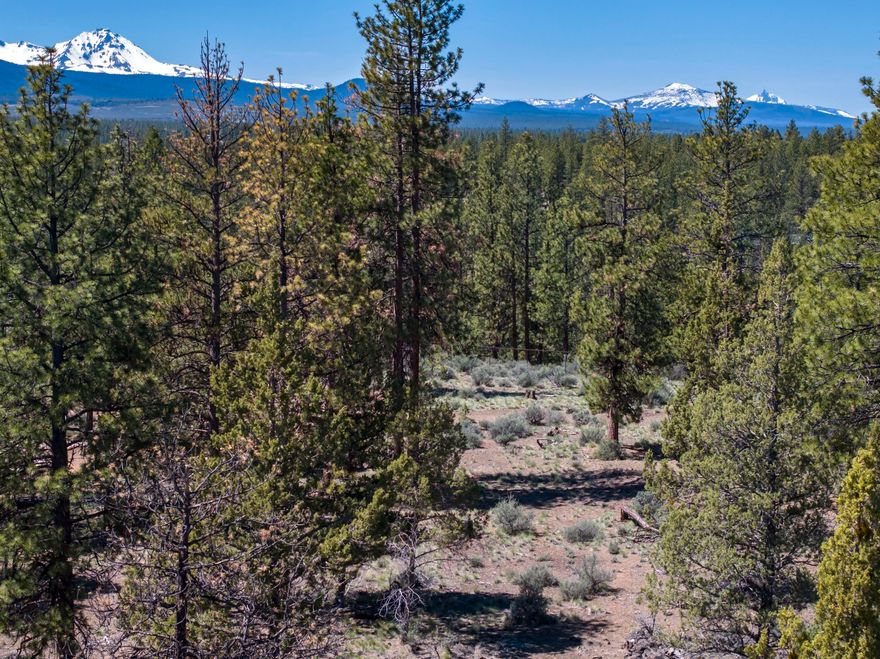 Situated in the highly sought-after Skyline Ranch neighborhood, this exceptional 2.5-acre lot offers the ideal balance of seclusion and accessibility. Experience the peaceful charm of country living with stunning Cascade Mountain views, all while being just minutes from town conveniences. This is your chance to build the home of your dreams on the desirable west side. With Shevlin Park nearby, you'll enjoy year-round outdoor adventures—whether it's creekside play with the kids or scenic walks with your four-legged companion. Don't miss this rare opportunity to create your personal retreat in an unbeatable location.