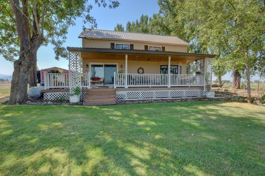 Looking for a place to run cattle, horses and grow your own hay? Or perhaps you are interested in a Vineyard, this property has so much to offer! With 35 acres of irrigation and a year round pond, the possibilities are amazing! Home sets up on a knoll overlooking the beautiful surrounding land and mountains.