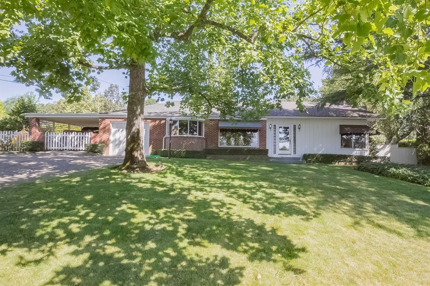 From the moment you enter, you will feel right at home. The warm hardwood floors, arched doorways, wood burning fireplace, glass block accents around the front door and custom cabinetry retain the charm of the era. However, the modern gas furnace, A/C system and electrical panel provide some of the many conveniences of today. The spacious living room has a corner, brick fireplace. The adjacent formal dining area has a gorgeous built-in hutch with glass doors. The cozy kitchen has a breakfast nook with built-in booth. The Bath has a tub/shower. The third bedroom is currently being used as an office/den but the area with built-ins could be converted back to a nice closet. The backyard oasis has a beautiful solar-heated inground pool, large patio, palm tree and other mature landscaping making it perfect for entertaining. The single car garage has an adjacent drive-through carport which provides access through the pretty gate to a street at the back of the property.