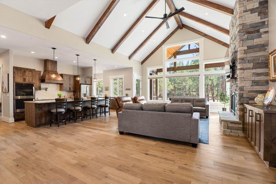 Move-in ready home that can close as quickly as Buyer needs. Over 100k below appraised value. This like-new NW/contemporary style Aspen Lakes home is in a neighborhood featuring an abundance of social activities beyond Golf and is acknowledged by professionals as one of the best run HOA's in Oregon. Home features: Single level; Abundant natural light; Gourmet kitchen, eating nook, large pantry, high-end stainless appliances; Large primary with deck access, walk-in closet & shower; Hardwood floors throughout; High vaulted ceilings & beams; Stacked rock fireplace; Office/extra bedroom on Primary wing; Two additional bedrooms/full bath on other wing; Large laundry; Giant bonus room between garage and laundry; Automatic blinds in living/primary; Cement siding; Automatic generator; Huge rear deck with vaulted covered areas; Built-in grill; Jacuzzi; Oversized two car garage (epoxy floor finish); Huge attic storage with finished stairs; Lake, pond and hole 1 views with numerous amenities.