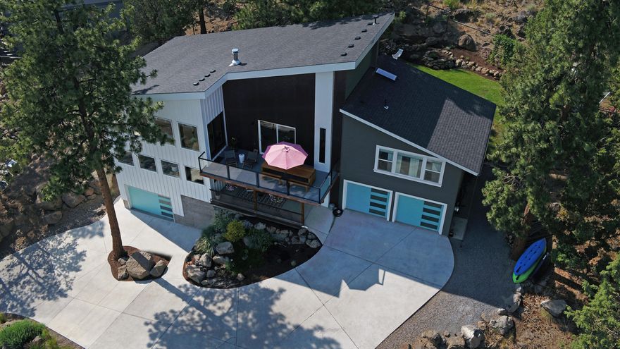 Cascade Mountain & Bend city views are just one of the amazing things about this West Hills home! Home features 4 beds, 3 full baths and 2 great living spaces. On the entry level there is an expansive entry w/ built in custom bench, family room, 3 beds and fully renovated bath. Up the custom stairway you'll find a beautifully renovated kitchen w/ large pantry, Wolf range, built-in wine fridge, custom cabinets and quartz countertops. Additionally, there is a sitting area w/ wood burning stove, great room w/ amazing natural light, big picture windows w/ views of Mt. Bachelor, gas fireplace, built-in desk space & full bath. Off the living/great room is an entertaining deck with views of the city. The spacious primary bedroom has a large walk-in closet & bath w/ heated floors & frameless glass shower doors w/ a two headed shower. The exterior is fully fenced & landscaped, modern shed, hot tub & 3 car garage. This is a wonderful and quiet location and a must see!