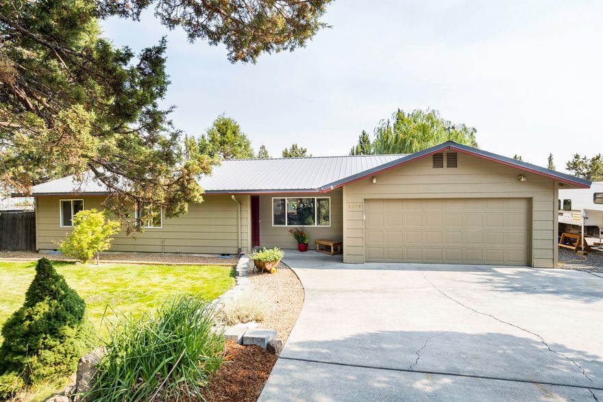 Don't miss out on this beautiful home on a half acre in Redmond! Close to town, but private. You will love the stunning fully fenced back yard oasis with a covered deck, mature plants galore including  hops, fruit trees, flowers, a large willow tree, hot tub, and cute garden shed/ workshop. Shed is insulated, heated and has electricity. RV parking with power and  sewer hookup.  Inside you will find a completely remodeled kitchen with knotty maple soft close drawers and cupboards, back splash and  granite counters. Cozy wood burning fireplace in living room.  Home also features  maple hardwood floors and remodeled bathrooms. Metal roof was installed in 2017. Pride of ownership shines through in this turn key home!