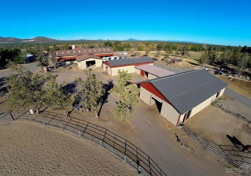 Cline Falls Ranch is one of or is the oldest working ranches still in operation today in Redmond, OR. This beautiful 62.73 acre ranch w/30.7 acres of irrig. is nicely set up for your horse/cattle operation. Currently a horse boarding facility complete with indoor & outdoor arenas, breeze-way barns w/box stalls/turnouts, hay storage & the old iconic Silo. In excess of 24,000 sq. ft. of accessory buildings can be used for agriculture storage or horse boarding. The 3/2 older charming ranch home rounds this place out perfectly. A must see! Owner terms possible.
