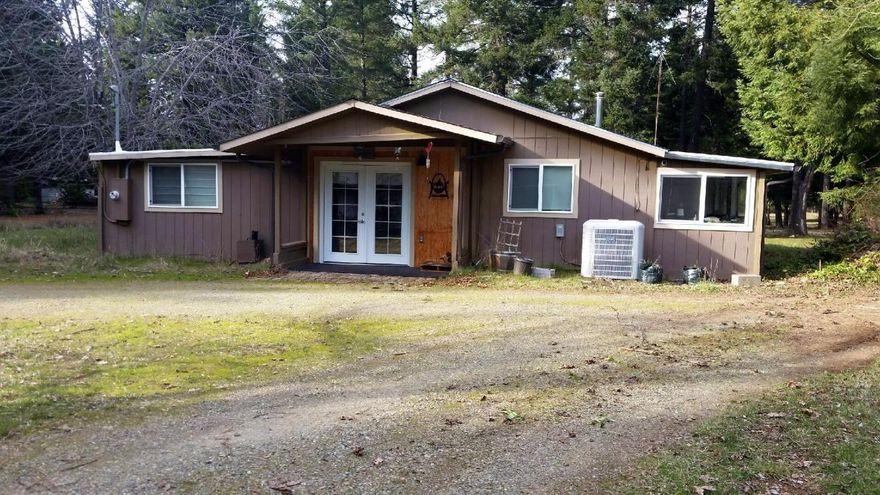 Seeing is believing! This very comfortable home, has totally been remodeled, every room. Walk thru front door & see this modern style kitchen,(remodeled apprx 3 yrs) with large island for the glass top range. Solid cabinets, pull out drawers under cabinets, with slow closing doors. Range hood is very complimentary to the kitchen, has a sheer protective cover, that lights on the edges when turned on. All stainless appliances , including wine cooler. Small office area in kitchen too. Living room, has all new carpet, certified wood stove,barely used, new ceiling fan, freshly painted thru out the home. Home has 2 bedrooms of record, could be 3, with the room just past the living room. The baths, are truly a delight. One (master) has a huge walk in shower with a very special shower bar that has sprayers at different levels. Special indeed! Double vanity, tiled with Talavera basins from Mexico. (both baths have same basins.) Huge shop/garage, w/loft & studio. Pretty land backed by BLM.