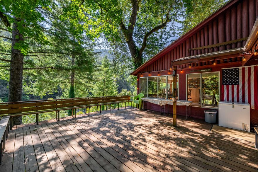 Marial Lodge is located in the heart of the Wild & Scenic section of the Rogue River, and as such is one of the most secluded and historic lodges in Oregon. Surrounded by old-growth forests, dramatic canyon walls, and at the epicenter of world-class fishing, rafting, and wildlife viewing, Marial is one of a small handful of lodges allowed to operate in this protected area. It is one of the only lodges on the river that guests can access by boat, hiking trail, or vehicle, and is the only lodge with ADA accommodations. Marial's cozy rooms and rustic charm offer an authentic off-grid experience while still providing the essential comforts, making it a popular destination for rafting outfitters, hikers, fishing enthusiasts, and retreat groups. The property includes 17 rooms for a total occupancy of 36 guests, as well as employee housing and manager's quarters. Established in 1903 as a remote post office, Marial is historic, unique, and a turnkey operation ready for its new owner!