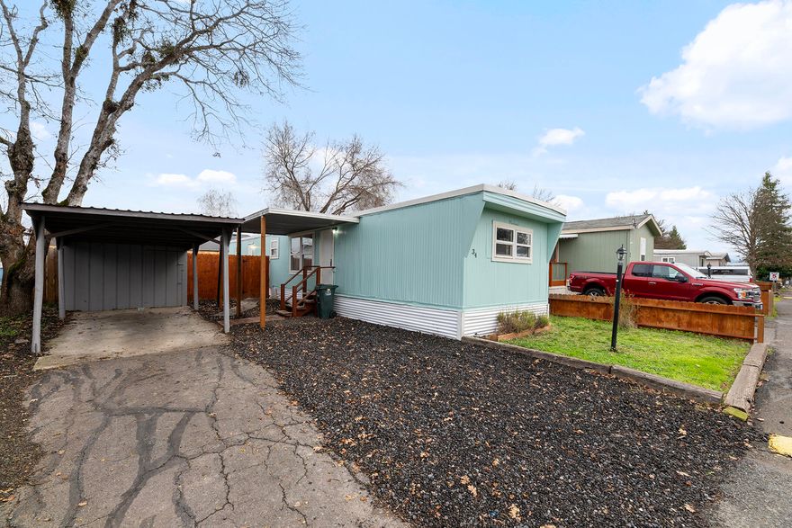 Beautifully updated single-wide residence nestled within the charming Idlewood Mobile Home Park, offering a serene lifestyle with no age restrictions. This thoughtfully designed 2-bedroom, 1-bath home features an open-concept living area with laminate flooring and a well-appointed kitchen with dining space. Newer appliances included:  range oven, dishwasher, refrigerator, washer dryer.  Enjoy outdoor living in the spacious, fully fenced backyard complete with lawn and storage shed. One of the lowest space rent in the Rogue Valley!  RV and boat storage options are available for an additional fee.  Ideally located near Eagle Point Golf Course, schools, and city services. Park approval required. Home offered as-is.