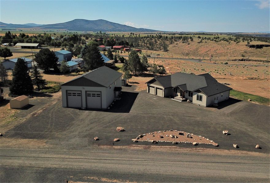 Exceptional 1 acre custom-built home w/expansive & unobstructed Cascade Mtn. views located at the entrance of Lake Billy Chinook & Cove Palisades State Park.  This 2107 sf home has 3 B/R, 3 Full Baths  Knotty Alder custom solid wood cabinets, doors & trim throughout. Open concept w/one-of-a-kind stacked stone propane fireplace w/raw edge solid juniper mantel. Chef's kitchen w/all the amenities a fine kitchen should have plus island to seat 6+. Primary suite boasts 4 pc.bath, walk-in closet, oversized sleeping area
w/walk-out slider to private deck. 2 additional bedrooms plus hall bath & flex room---
office/craft/reading---make it your own. Front & rear porches are covered, & back deck has privacy half walls. The bonus is a 36' X 60' custom shop, fully insulated walls & ceiling, w/3pc. bath. Upstairs bonus/flex room, RV parking w/hook-ups, with 2 12'x14' roll-up doors & 1 9'x8' roll up door, workbench lots of storage AND so much
more. See Amenities Sheet on back of flyer or in docs
