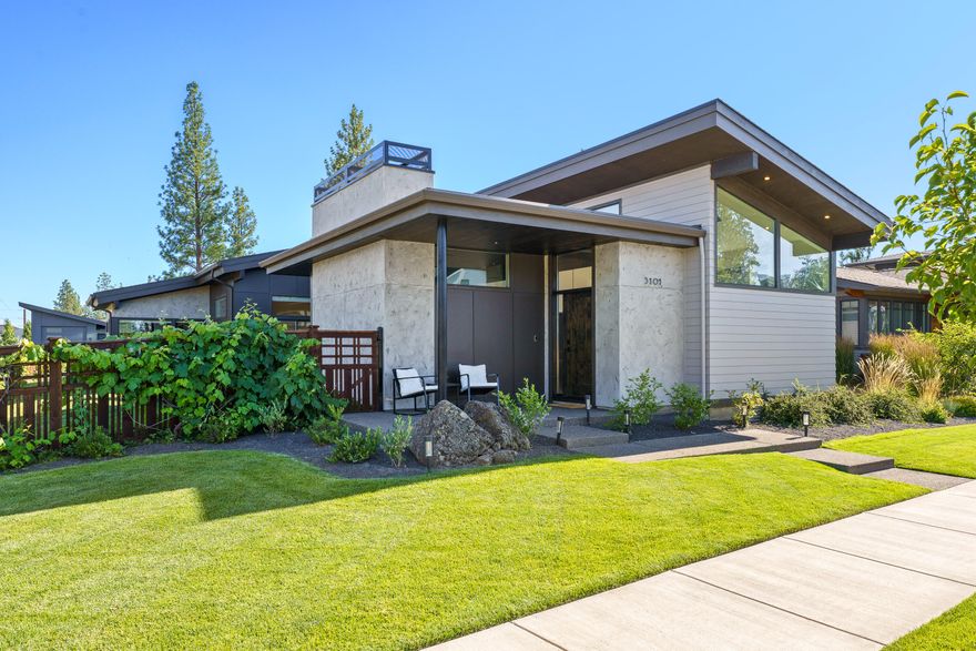 Stunning 1,976 SF mid-century modern home in Discovery West, blending style, comfort, and location. This 3 bed, 2 bath residence features beautiful finishes throughout, including custom cabinetry and an incredible primary suite with a spa-like bath. The open-concept layout offers modern livability with timeless design. A 3-car garage with sprinter bay adds versatility. Step outside to a private courtyard with a tranquil fountain-perfect for relaxing or entertaining. Near trail access and Discovery Corner.