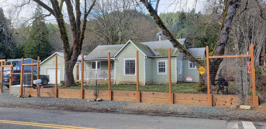 Cozy 3 bedroom 2 bath home on .27 of an acre. Wood stove keeps entire home warm and cozy. Master bedroom with it's own bath, Good sized bedrooms, kitchen is open to dining area and living room. Large laundry/mud room. Property is fully fenced and cross fenced. Tiered backyard with great play area for the kids. Plenty of fruit trees and lots of room for a garden. Detached garage/workshop. Property next door is also available which would make this a great 2 family set up. See MLS #2999336 & #2999346 for details. Across the street from the Sunny Wolf Charter School.