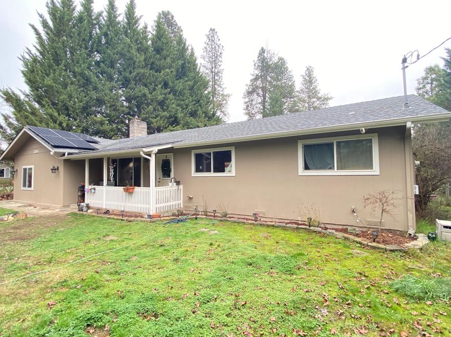 Serene Country Setting Ranchette! Are you ready to enjoy peaceful evenings from your back porch? This darling Ranch Style cutie that offers a 4 bedrooms, enclosed patio room and 2 full baths.  Stunning Updated Modern Kitchen with corian counters, stainless Bosch dishwasher and abundance of cabinet storage. Family room offers a cozy brick hearth and wood stove to keep you warm on those chilly winter days.  Bring your Toys, Tools, Boats and RV's on this .92 acre Lot with an expansive Yard that also features a completely fenced acreage.  Energy-efficient home with NEW OWNED solar; current power bills average approximately $50 per month year-round. Wonderful features on this Amazing Home where you can enjoy everything County Living has to Offer.  Come, See and Fall in Love!