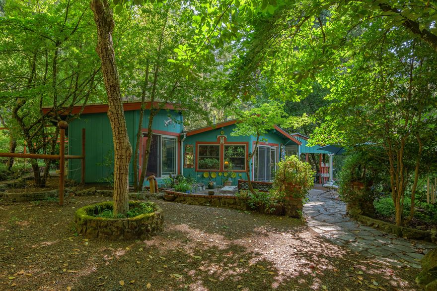 Incredible 13.28-acre property with 1,706 sq ft home full of charm. And Property is USDA eligible. A creek runs through part of the land, with a heated pool for relaxing days. Enjoy a large detached wine cellar with office/bonus room above, plus a separate garage/shop with bonus room and balcony. The land offers privacy, natural beauty, and room to explore. Ideal for outdoor lovers with direct access to miles of trails and BLM land. Just minutes to Lake Selmac for fishing, kayaking, or camping. Don't miss this unique Southern Oregon gem—schedule your showing today!