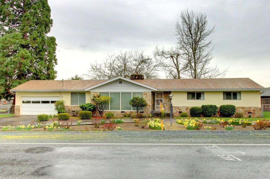 Live in your own personal park setting. This solidly built home has character and a unique design that allows for entertaining and also quiet and cozy spaces. There is a large master suite with walk in closet and step down sun room that looks out onto the lovely landscaped back yard. The family room has a raised hearth fireplace, a slide to the outdoor patio, and access to the sun room. From the attached 2 car garage, you can walk through to your own spacious, well-lit, air-conditioned work shop with storage. The back yard is completely fences with beautiful mature trees, irrigation with a well-built garden shed, and garden area. The roof is just over 2 years old. This home is in a perfect location to access shopping, medical care, parks and all that Grants Pass has to offer. Offered at $275,000. Home Warranty included.
