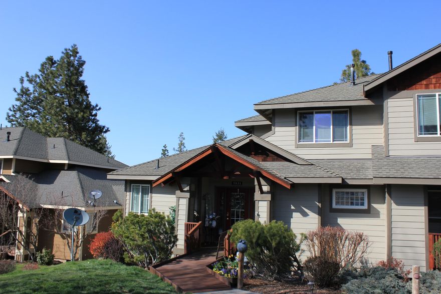 EAGLES LANDING AT RUNNING Y RANCH RESORT.  This end unit of a tri-plex building is situated on a ridge line with a panoramic view of mountains and portions of golf course. This beautifully furnished home has two levels. Main level has open space that flows from front to back – kitchen with breakfast bar, dining area and living room. Master bedroom suite with deck access is also on the main level. Kitchen has all appliances included. Upper level has 2 bedrooms and jack & jill bathroom. Deck area includes fire pit and four chairs, as well as grill and smoker.  The deck structure is to be replaced the first week of July. Conveying with the property is smart audio/video system. The HOA maintains a fitness center with indoor pool/spa, pickleball, tennis, volleyball and basketball courts, and a fishing pond. Other resort amenities include market/sandwich shop, WorldMark timeshare facility, Indian Desi Masala Restaurant and Shagi Mane salon.