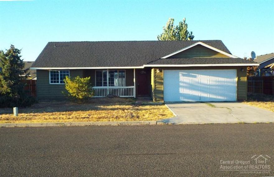 Single-level with covered front porch, open vaulted floor plan, boasts nice separation of bedrooms. Master bedroom features walk-in closet & adjoining bath. Bedrooms 2 & 3 are served by main bath, both baths include windows. Cute kitchen has oak cabinetry in nice condition, and breakfast bar. Sliding glass door gives easy access to private patio in fenced back yard. Separate utility room with closet, situated between garage & kitchen. Level lot includes spacious RV parking beside the double garage.