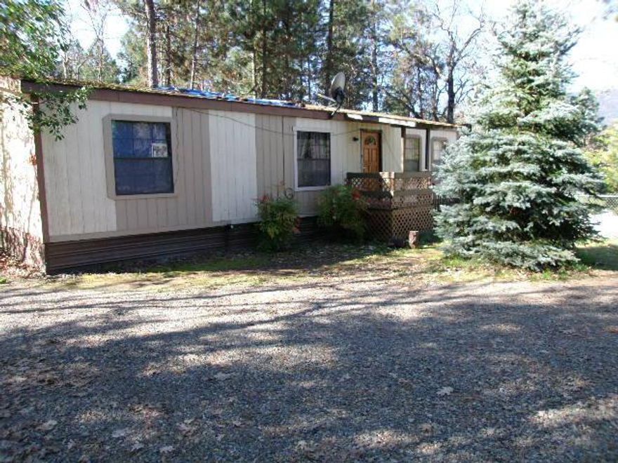 Good location in the city of Cave Junction. A very nice large city lot. Owner will carry with $30K down, 6%, 10-15 years. Seller is a licensed real estate broker. New roof by 11/15/14.