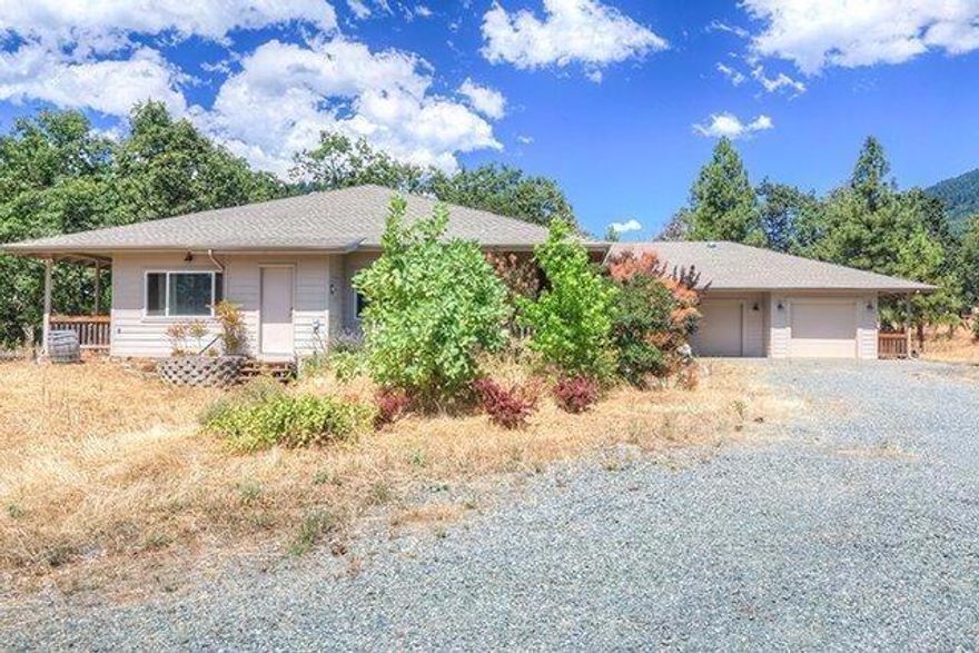 This bright and spacious 2006 single level custom home sits on 2.87 level acres. Bummer Creek runs through property and also enjoy the lovely mountain views. Bright large open kitchen with beautiful custom hickory cabinets. 8 Solar tubes and custom windows give natural light throughout the home. 4 bedrooms and walk-in closet in master bedroom, possible 5th bedroom and HUGE bonus room that could be used as a workshop or very large craft room that used to be used as an artist studio. Two car attached garage. Wheelchair accessible and no steps. Other features include 2 hot water heaters with a tankless on demand hot water feature, central Vac, 9 foot walls, a covered walk around patio and a solarium. Sink in bonus room included in sale.