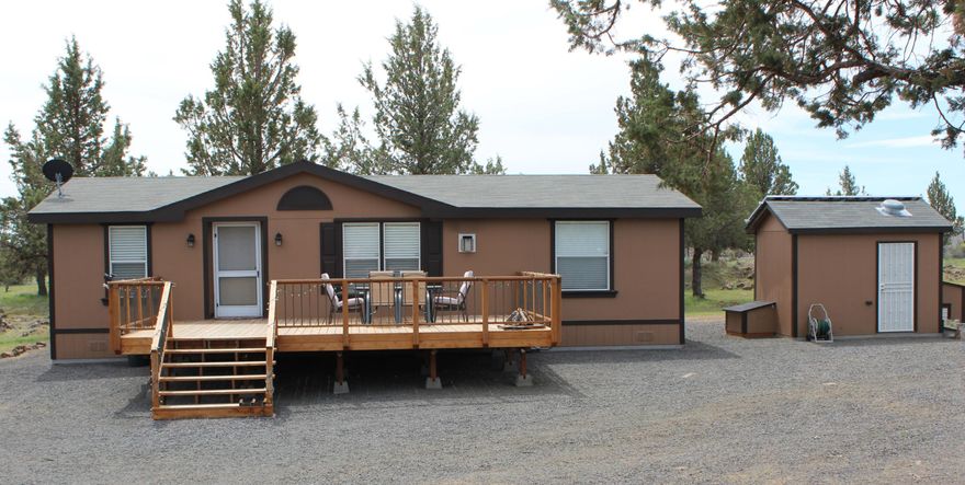 Double wide on -5 acres, move-in ready & fully furnished. Classy & comfortable for recreational OR full-time living. Solar,
cistern, generator back-up & peek of Mt. Jeff. This property is perfectly situated at the end of the road for quiet privacy
w/huge circular driveway w/several bump-outs for friends & family car or trailer parking. Classic design for entertaining
indoors & out. NO showing Aug. 7-16.