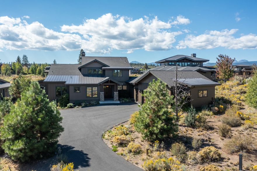 Welcome to this beautifully appointed Tetherow masterpiece. This home boasts a fantastic floor plan with gourmet kitchen opening to a two story great room, with magnificent fireplace and perfect dining area. The generous primary suite is on the main floor with a walk-in closet and opens to an inviting back patio on the golf course with a great firepit and  hot tub that take advantage of both the golf  course and cascade mountain views. Also on the main floor are the junior suite, dedicated office and oversized 3 bay garage. Upstairs are two beautifully appointed bedrooms, a full bathroom and bonus room. Large capacity wine cellar in the basement, high end finishes throughout and quality design complete this charming and functional home. Tetherow amenities include workout facilities, outdoor pool, two restaurants, snack bar, golf course, walking trails and close proximity to Phil's trailhead, downtown and access to Mt Bachelor.