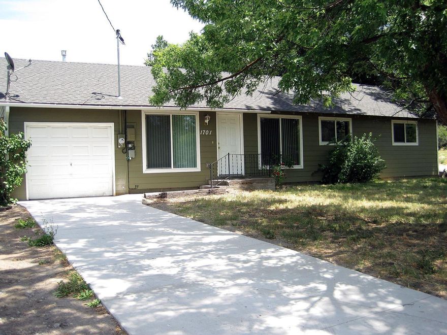 This charming home sits across from a park and was updated in 2010. The home features vaulted ceilings, newer kitchen with appliances, newer flooring, a newer gas furnace and roof, a new concrete driveway and a large yard. This home is ready for you to move right in!