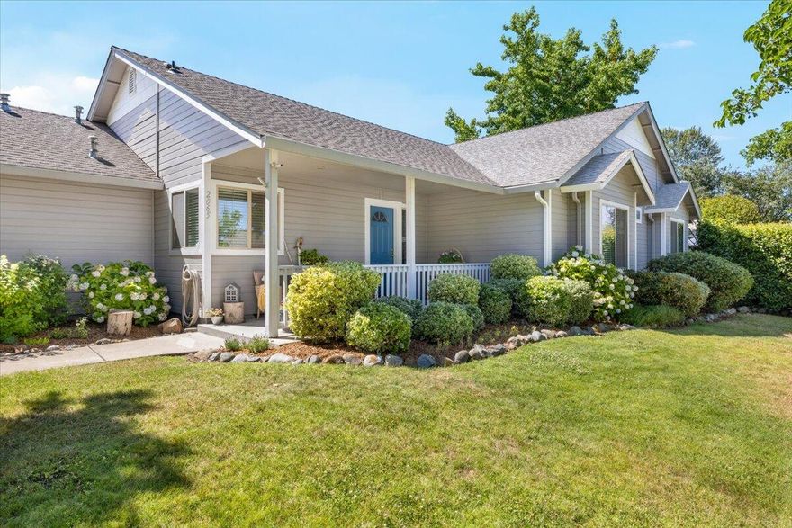 Premium corner lot in picturesque Hampton Place across from RogueX. This impressive 3 bedroom, 2 bathroom home exudes curb appeal with a large front yard filled with perennials for year round beauty over and over. Walking up you'll find an inviting front porch for morning coffee. Inside you're welcomed by newer flooring and fresh paint. The living space is large and open with vaulted ceilings and large windows. The kitchen has good storage with lots of counter space and a corner window to enjoy the beautiful park-like yard. The primary suite features vaulted ceilings, a walk in closet, large bathroom with walk in shower and a private patio. Two additional bedrooms are spacious with large closets and windows. Step outside to a gardener's dream featuring an expansive sun porch and a beautiful backyard filled with hearty sunflowers, organic vegetables which will keep you stocked thru the fall. Two car garage with plenty of additional parking.