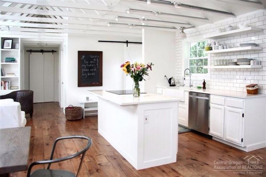 You will fall in love w/ the updated style of this home! White walls, wide-plank solid pine floors, farmhouse sink & barn door sliders add to it's charm. Walls were removed & skylights added to create a light-filled open-living concept. Kitchen features quartz & butcher block counters plus new stainless appliances including island induction cook-top. French doors lead to spacious yard. Plenty of room to expand and add value! Quiet area w/ large lots and separation from neighbors. Hurry before it's gone!