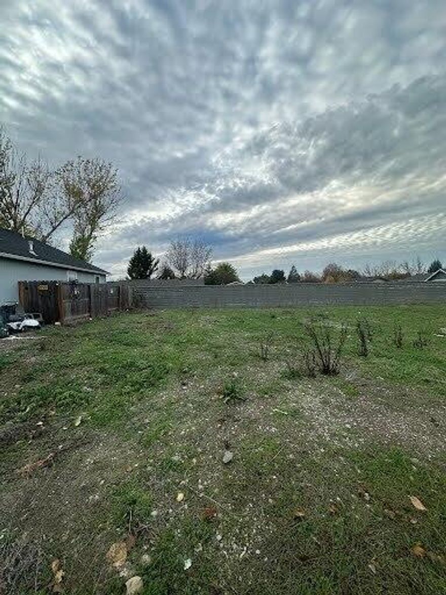 This lot is flat level and easy to build on. It sits in a quiet tucked away location with established homes on both sides and a solid block wall along the back for privacy. It is very close to a park and schools and only minutes to town. A perfect detached single family lot for someone ready to start building right away.