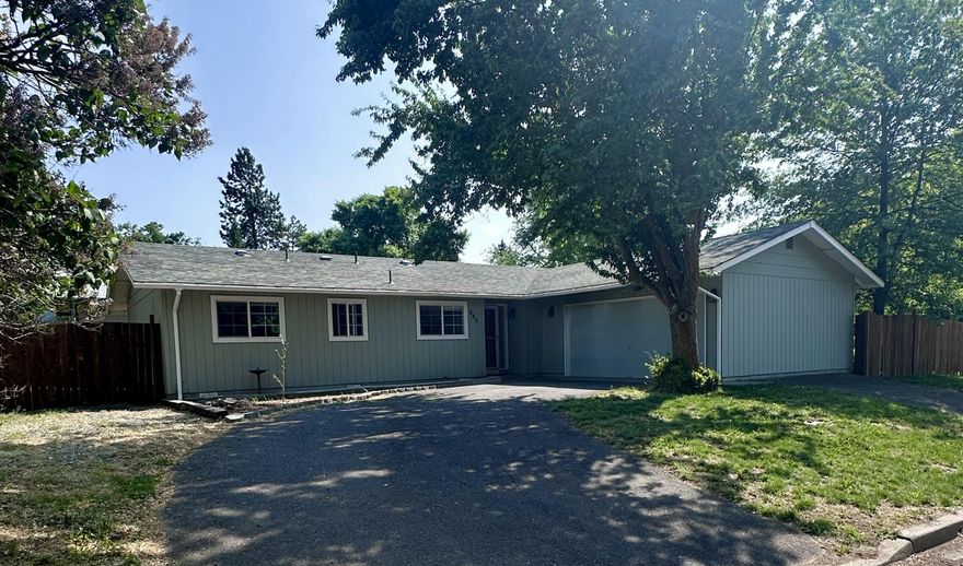 Welcome to this beautiful 4-bedroom, 2-bathroom home located near downtown Klamath Falls. This well-maintained home offers comfort, space, and convenience. With plenty of room for guests or a home office setup, this property is designed for modern living.  Inside you'll find a functional floor plan featuring a bright living area and open dining space. Outside you can enjoy a fenced yard that will be great for gardening, or relaxing under the open Klamath skies. There is a spacious driveway with a two-car garage, and additional off-street parking spaces. The property is located near Sky Lakes Medical Center and Oregon Institute of Technology. This is a great home that you won't want to miss out on!