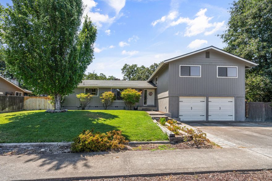 Beautiful and well-cared for tri-level home in Old East Medford! Located near Rogue Regional, Rogue
Valley Country Club, and close to downtown Medford.	This 4 bed, 3 bath, 2691 sq ft home sits on .23 acre lot, and backs up to Holmes Park! Interior features solid bamboo flooring, crown molding, fireplace, and tons of natural light throughout! Home includes formal dining room, family room, living room, breakfast nook; and the daylight basement features a large finished flex space (den/office/gym)
with tile floor, as well as full third bath/utility room.	A beautifully landscaped back yard with in
ground swimming pool, gazebo and mature trees.	Amenities include newer forced air/central heat. Exterior features a newer roof, newer exterior paint, low maintenance landscaping with partial in-ground sprinklers, fully fenced yard, 2 car attached garage with electric opener, RV parking.