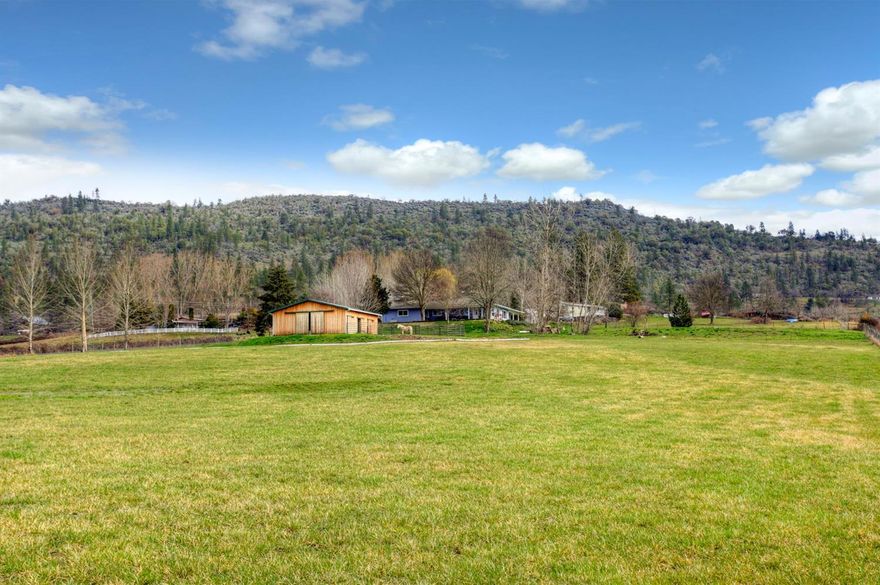 Location! Location! Totally turn key ranch property sitting on a knoll overlooking beautiful irrigated valley just north of Eagle Point. Corner parcel w/RR-5 zoning, fully fenced & gated w/24'X24' insulated & heated shop & 36'X36' 3-stall barn w/paddocks, hay storage, tack room & wash pad w/hot & cold water. Single level living in this well-maintained ranch home w/views from every window! Light & bright w/laminate flrs & coffered ceilings in the living rm, spacious formal dining & breakfast nook in the galley kitchen w/gas cooktop & dbl wall ovens. Lg master suite w/walk-in closet, dbl vanity, walk-out shower & private access to cvrd patio. Handicap accessible w/3ft doorways, lg utility/mud room, sky lights, central vac system, propane HVAC w/electronic air filter, solar hot water system, expansive cobblestone style patio for your outdoor living, EPID irrigation, fruit trees, perennial gardens, grape arbor, finished oversized 2-car attached grg, dog kennel & cvrd RV pkg! A must tour!