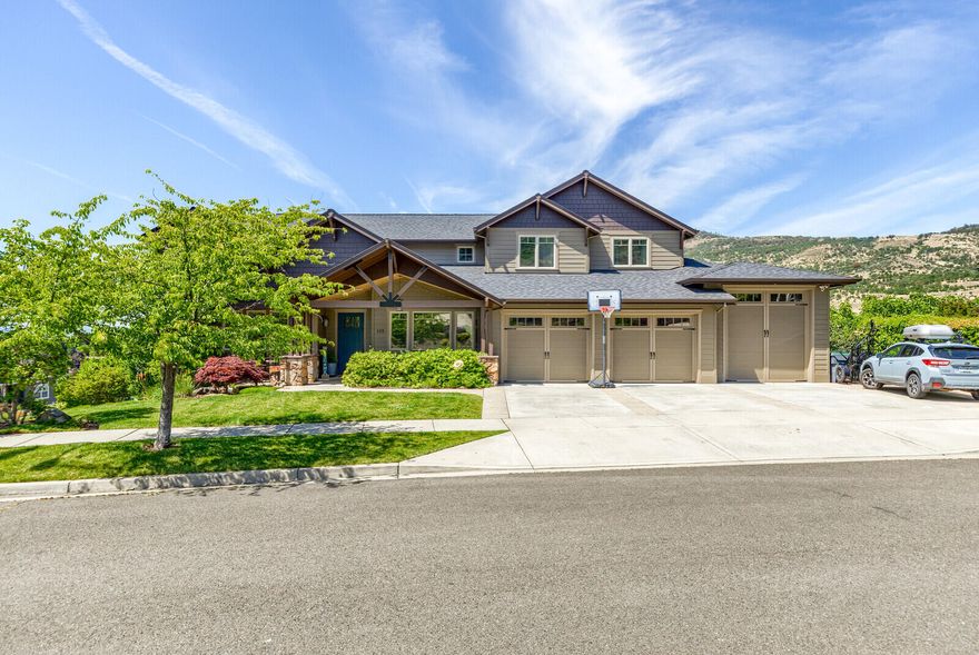 Prepare to be impressed.  This magnificent custom built 6456 square foot East Medford view home offers a fine blend of quality, comfort, function, & design. Home features an incredible floor plan, ideal for large families & entertaining, with an enormous gourmet kitchen, large butler's pantry, & passthrough wine bar to a formal dining room. The primary suite offers a dedicated sitting area to take in the views. There are 3 additional ensuites, a 5th bedroom, a large office or 6th bedroom, & a spacious lower level game room with kitchenette.  In addition, this home features a custom craft room with laundry facilities, a 2nd upstairs laundry room, & a sweeping stairwell to upper level loft & catwalk that crosses over the grand and open great room.  Outside features included an oversized 3 car garage with 11' door for RV's, plus an additional lower level 2 car tandem garage with sliding door to large workshop area. Too many features to list...
