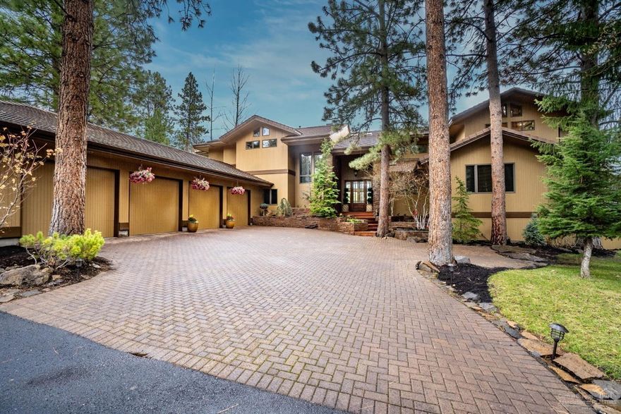 https://vimeo.com/410851798. Elegance, high quality, private location at the end of cul-de-sac, trees, and beautiful views of the 10th Weiskopf-Morrish fairway and club house. Spectacular living room with massive stone heart fireplace, wall of glass, and cathedral ceiling, impressive office with built-in cherry cabinetry and desk, spacious bonus room (can be second office or 5th bedroom), gourmet kitchen with brand new Brazilian Patagonia granite counter tops, island, custom cabinets, and walk-in pantry. 4 en-suite bedrooms, one of them downstairs, master suite with sitting room, bar, huge closets,and beautifully remodeled bathroom. The breakfast nook has a fireplace and built in cabinets. Spacious family room with build in shelves and access to an outside patio. Wine cellar with temperature controlled, and the spacious utility room has lots of cabinets and counter space. 4 car  garage. The 1434 SF deck was just refinished, and the outside/inside of the house was repainted. Nice lands