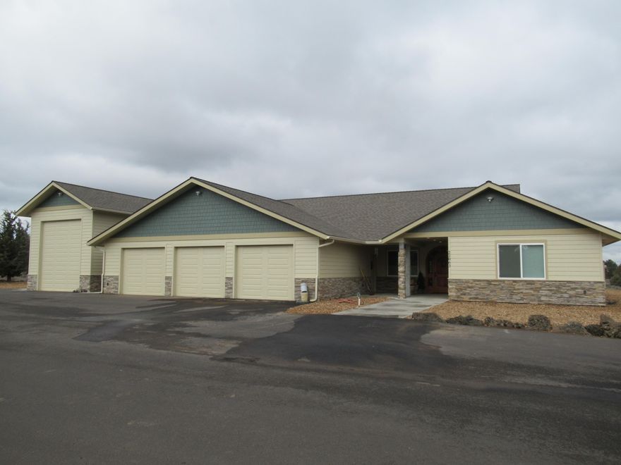 Cascades views from this close-in 10 ac. property, SE. View fireworks, too.    Single level, almost new home, with great room plan, beautiful woods, granite counters. Huge pantry. Built-in stereo cab., built-in dining hutch, gas pot belly stove. 4 bedrooms, 3 baths, lots of parking. Greenhouse room, heated, & enclosed swim spa room are extra footage, as indoor patios. Covered front porch; open back patio with gas hookups for outdoor fireplace or heater & BBQ. Triple oversized garage, plus RV garage, and 2000' detached metal shop with carport.  Easy care natural landscape & rock scape. Home has RV hookups. Shared paved driveway with agreement & locked joint mailbox system.  Only 5 miles to 27th & Hwy. 20, for shopping, restaurants, & other services.
Neighbors are all on 10+ ac. parcels, most are irrigated, horses & other pets allowed.  No HOA.  Potential to purchase neighboring property for corporate or private compound. Call for information.  
Owner/Agent is OR real estate licensee