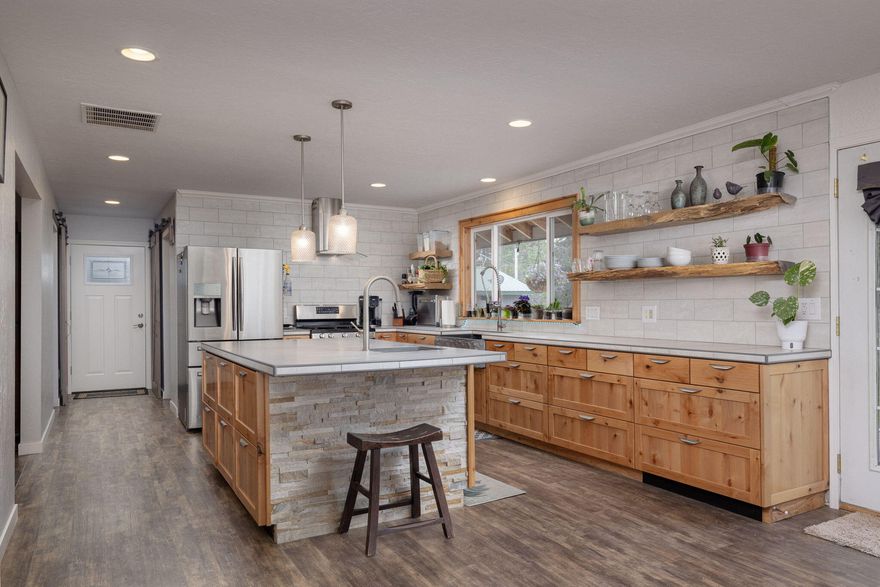 Beautifully updated 4BR/2.5BA home on 1 acre backing to BLM land! This 2,100 sq ft home features a remodeled kitchen with open floor plan, modern baths, and abundant natural light. Major updates include a new metal roof, new well, and new septic system. Property is horse-ready with fencing and flat, usable land. Ride directly into miles of BLM from your backyard! The standout feature: a massive 1,800 sq ft shop with power—perfect for RVs, a workshop, or home business. Rare combination of turnkey living, equestrian setup, and serious shop space in peaceful La Pine. Contact your real estate broker to schedule your showing today!