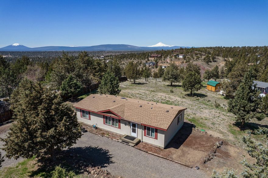 Central Oregon living in Crooked River Ranch with Cascade Mountain Views! Custom Marlette Home features 3 bedrooms, two baths on 1.04 acre view lot. Open plan w/vaulted ceiling features a spacious living area w/tons of natural light. Kitchen offers tons of cabinet space, breakfast bar seating at the central island, butcher block counters & corner pantry. All appliances included.  Eating area w/sliding door to deck. Well sized primary bedroom w/bath features a dbl vanity & soaking tub. Two addt'l bedrooms share a full bath w/step-in shower. Full laundry room w/storage, washer & dryer included. Plenty of space outside for your RV, toys, pets & more! Short distance from CRR resort amenities; swimming pool, tennis/pickleball courts, 18-hole golf course, RV Park, MacPherson Park & Pavilion, Panorama Park, baseball field, basketball court, horse arena, restaurants, miles of trails & other Ranch amenities. Home has been moved twice - lending options available for VA & Conventional buyers.