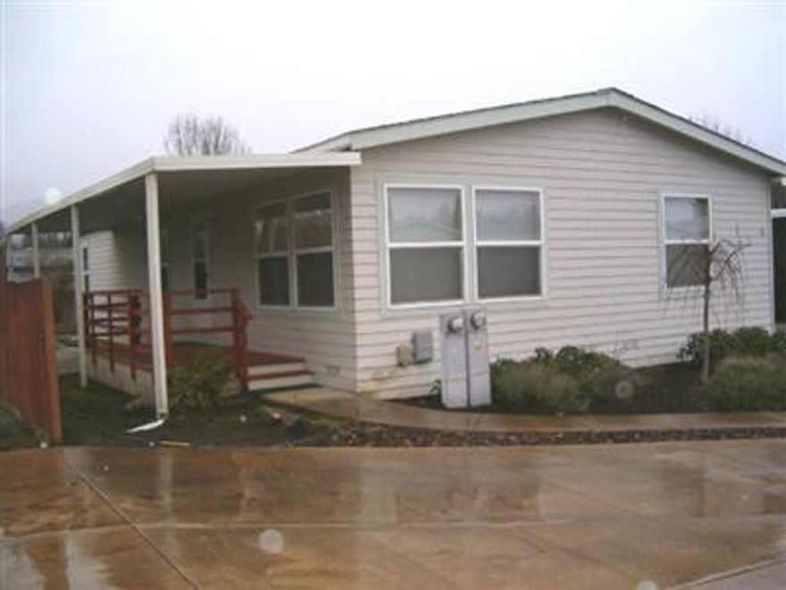 This is a super clean doublewide, vacant & ready for immediate occupancy. All age park, pets ok. Interior freshly painted & cleaned. Third bedroom used as a den. Backyard is fenced with a raised flower bed & shed. Reliable community water system. Very clean park. Home is on a cul-de-sac at east end of park.