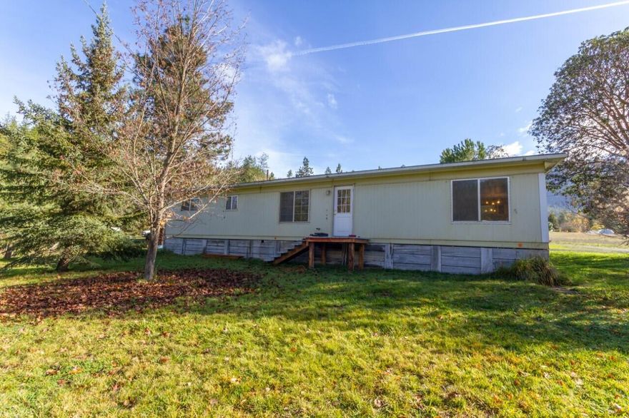 Hidden gem in the Applegate. Remote and private with beautiful views! Enjoy views of deer, wild turkeys, and hawks in their natura setting. This Remodeled 1971 manufactured home is nestled in the trees. The owner has put in laminate engineered wood flooring in the family room that is centered around a wood burning stove. The wood burning stove provides enough heat to cover the entire home. The living room has views of the mountain and is very spacious. The dining room has built in cabinets that serve as a hutch. The master bedroom has a built in vanity and its own bathroom that has been recently updated. The 2nd bedroom has a walk in closet and access to the 2nd bathroom that has also been updated. The 3rd bedroom would be ideal for an office. Come see these views today!