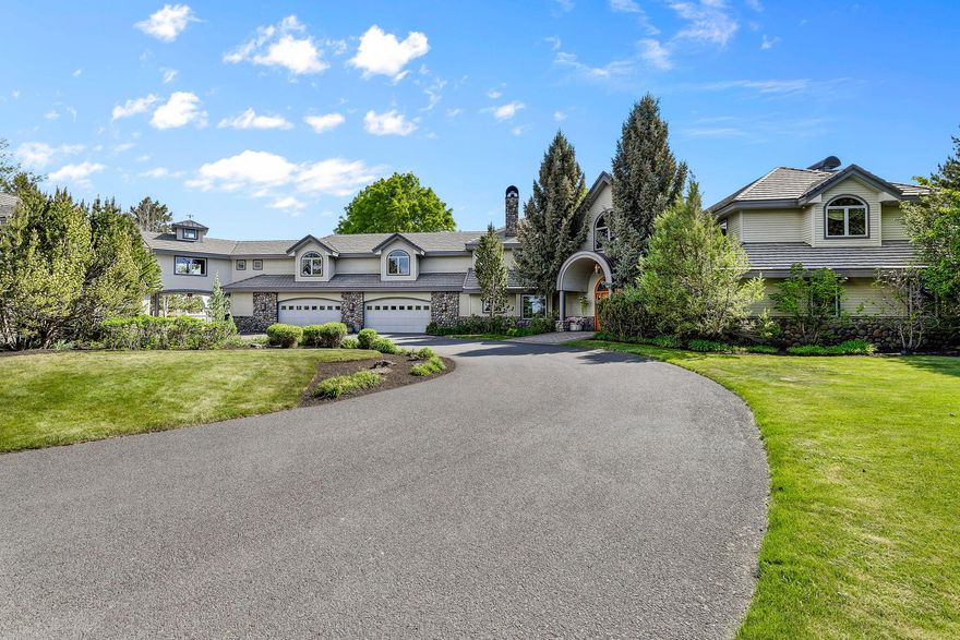 Owner will carry! Stunning 25.12-acre estate with unobstructed Cascade Mountain views and 11 acres of irrigation. The impressive 9,075 sqft 4-car garage home, offers 6 bedrooms, 6.5 bath and showcases granite kitchen counters, hardwood floors, and a soaring 30' VG cedar ceiling. Main-level primary suite includes a see-thru fireplace, spa-like bath with jetted tub. Features include a library, office, game room, guest suite, and a guest/staff apartment with a kitchen, bath, and laundry. Smart Lutron lighting/music, 9 heat pumps, zone-controlled heating, gourmet kitchen with Dacor stove and Subzero fridge. Enjoy the 990± sqft pool house with bathrm, steam shower, and sauna. Relax at the outdoor pool with slide, hot tub, and nearby Finnish sweat shed. Massive 26,539 sqft indoor arena perfect for motocross or horses, with stalls, tack rooms, paddocks, kitchen, full bath, and loft with viewing room. Gated property includes 375 spruce trees, fenced/cross-fenced, pasture, and two RV hookups.