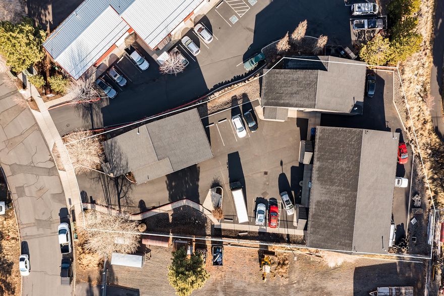 Industrial property in SE Bend consisting of three separate buildings. Two of the buildings are each 1,812 SF with two 14 ft roll ups, office/showroom, and restrooms. The largest building is 3,684 SF, and it's divided into two separate suites, each with office/showroom space, restrooms, and one 14 ft roll up on the front of the building and one at the rear of the building. 8 onsite parking spaces with excess storage/parking area at the back of the property. The entire property is currently leased to a single tenant with an upcoming expiration of 4/30/24.