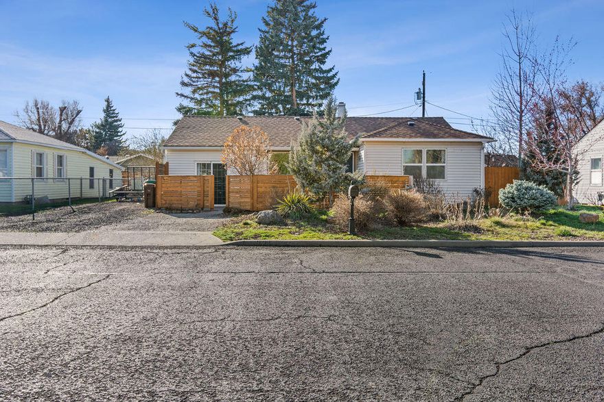 Step into this delightful move-in ready home featuring a newer roof, updated bathroom, and a modernized kitchen. Discover charming accents throughout, complemented by inviting wood floors that span much of the home's interior. With three main-level bedrooms plus an additional upstairs bonus room, there's ample space to accommodate your lifestyle. Venture outside to the fully fenced backyard, complete with a covered patio, perfect for alfresco gatherings and relaxation. Take pleasure in the fully fenced and landscaped yard boasting an array of fruit trees, including cherry, plum, peach, and pear varieties. Additionally, find a versatile flex space 'workshop, home office, gym, you name it' nestled in the backyard, providing endless possibilities for your personal needs.  Embrace the morning sunshine in privacy, courtesy of the front privacy fence, while savoring your favorite cup of coffee. Welcome to your new oasis of comfort and style!