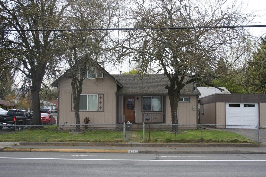 Nice home in NE Grants Pass. It is centrally located right behind the Grants Pass shopping center and real close to Grants Pass High school. The home is a three bedroom, one bath home that has just been remodeled. It has the kitchen completely redone. New laminate flooring on the main level. All new vinyl, dual pain windows. The laundry room has been redone and has a new gas hot water heater. It is a corner lot and has a completely fenced yard. All information deemed accurate, but is subject to change.