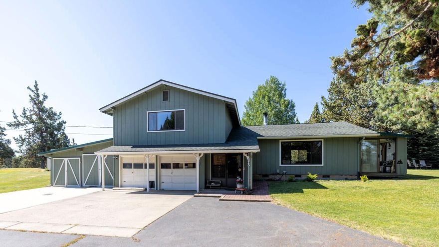 Discover the potential of this rare small acreage with irrigation in beautiful Bend. Privately located at the end of a quiet cul-de-sac, this 3 bed, 2 bath, 1,899 sq ft home sits on 2.48 acres with 1 acre of irrigation. Fully fenced and gated, the property features an attached 2-car garage and two large shops—a 45x65 shop with 14-ft roll-up door and a 24x36 shop with two bays and workshop. Rolling grassy hills, extra storage buildings, and plenty of room for hobbies, animals, or work. Inside, mini splits provide year-round comfort. In 2023, the home received electrical upgrades and 20 professionally installed solar panels, w/ direct Southern and Eastern exposure for excellent solar efficiency & storage, especially during our Central Oregon winters. Owned and loved by one family for over 40 years, it's ready for your updates and vision. Close to town yet private—perfect for a mini farm, retreat, or dream property. So much potential—just needs you. More Details: youtu.be/ZKuwFbvgmis