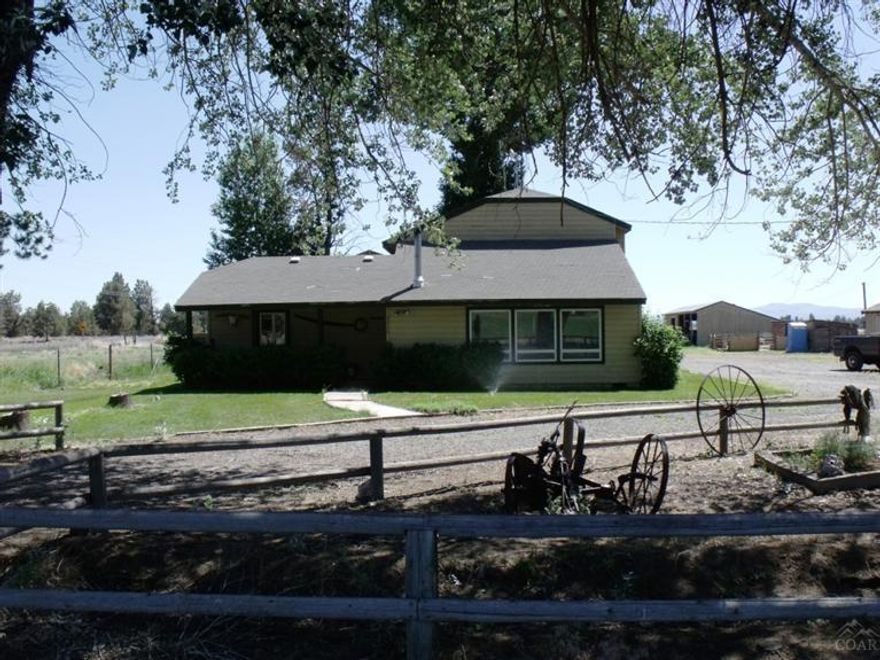 Perfect Acreage opportunity with many different possibilities! The property can be used as a great place to live and run your own ranch or can be used as income producing property this property has yielded 2.5 tons per acre of hay which is perfect for cattle, horses or to sell. The property features Lg hay barn, roping arena, and additional storage shed, The home has Master on the main level with beautiful laminate floors in the kitchen. Plenty of space for guests. Don't miss this Great Opportunity!