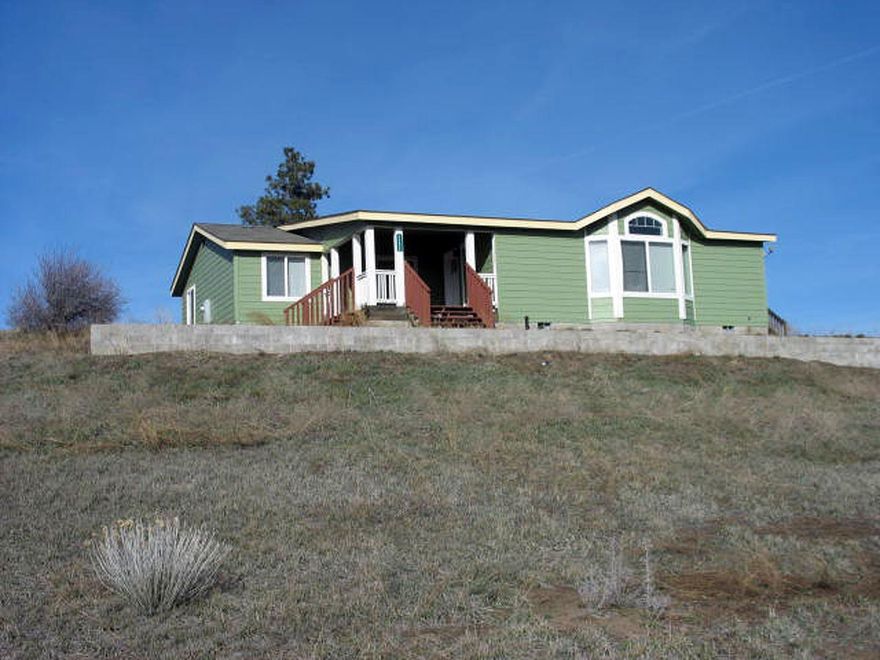 2008 triple wide, 1851 sq ft open floor plan that features 4 bed/2 bath manufactured home on .37 of an acre. Enjoy The Views Overlooking The Surrounding Mountains, Pastures And Lake. Oregon Shores 2 subdivision with access to a 17 acre common area on the lake for camping for home owners. Association fees are currently $200.00 yearly for road maintainance, water and common area use close to recreational area and Crater Lake.