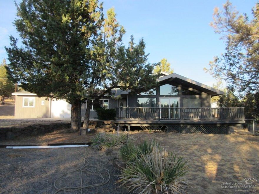 This Homepath property is unique. Located at the end of a very quiet road, the lot is large, and the house is in excellent condition. The interior has just been painted, and brand new carpet has just been installed. The living room is filled with light, and all the wood in the home gives it a very warm feel. The juniper log accents on the stairway are a work of art, and the custom wood doors throughout are beautiful. The appliances are brand new, and the woodstove will keep the place toasty in the winter.