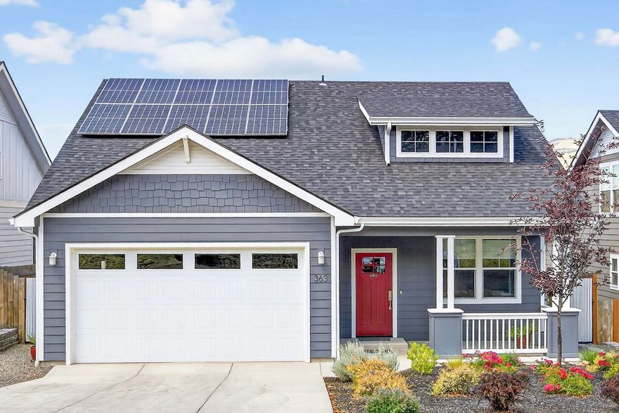 Enjoy expansive views from this 2021/2022 built, energy-efficient home, just under a mile from downtown Ashland. Thoughtfully designed for comfortable main-level living, the open floor plan features sizable windows with custom blinds, a sliding glass door to the back deck, a cozy gas fireplace, and well-appointed kitchen with custom cabinetry, quartz countertops, and stainless-steel appliances. The main level includes the spacious primary suite with deck access, a walk-in closet, and a beautifully tiled walk-in shower; an office/guest bedroom, half bath and laundry room. Upstairs offers versatility with a guest bedroom, full bath, and a sitting area that could easily be converted to a fourth bedroom or office. Outside, enjoy the landscaped front yard with a covered porch and a fully fenced backyard with irrigation, delightful plantings, covered upper deck and lower deck with hot tub setup. The owned, solar array, finished two-car garage & EV charger complete this exceptional package.