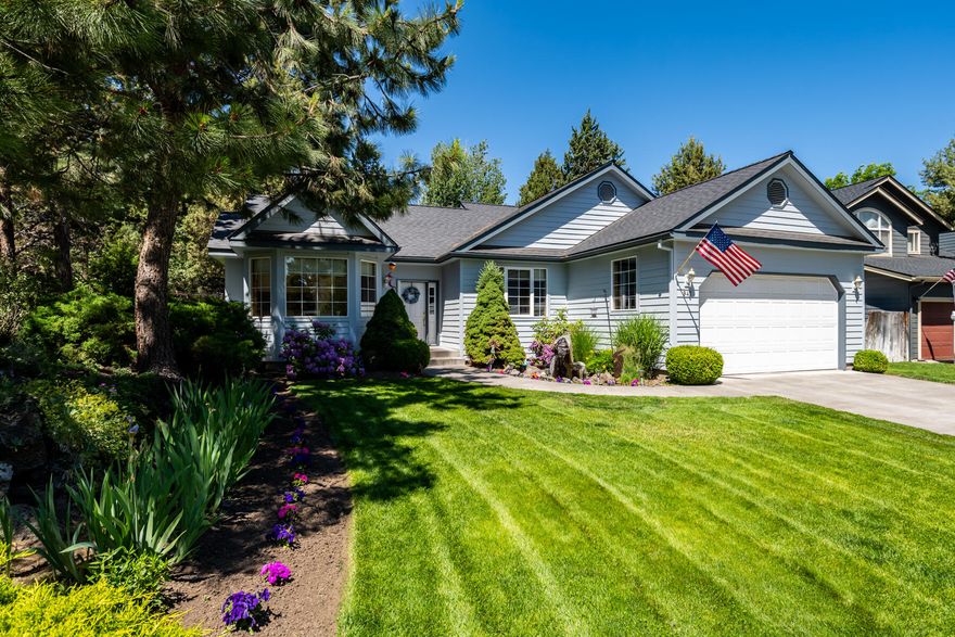 Gorgeous Tanglewood single level situated on a .20 acre, beautifully manicured building site in SE Bend. Conveniently located in a quiet cul-de-sac, this 3 bedroom, 2 bath, 1607 sqft home has an open great room floor plan with gas fireplace, vaulted ceilings with skylights, ceiling fan, and plenty of natural light. Recently remodeled kitchen is perfect for entertaining with attention to detail at every turn with both a formal and informal dining area. Spacious master suite with coved ceiling, ceiling fan, walk in closet and beautiful French doors that open to the back yard oasis. Elegant master bath with tile shower, soaking tub, and double vanity. Exceptional outdoor living area with huge deck, hot tub, and mature landscaping. This one won't last long. Call your broker for a personal tour today.