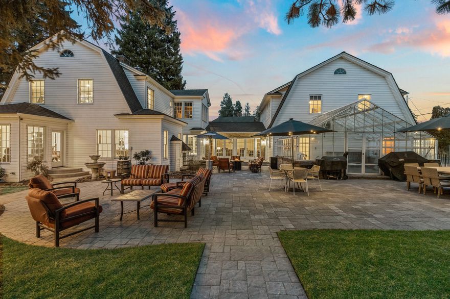 Classic in every sense, this grand Dutch Colonial estate is ideally set in a park-like setting with storybook views of the Deschutes River & iconic Drake Park. Built in 1921, on an oversized corner lot, this historic treasure has been lovingly cared for and masterfully updated by the current owners. Outdoor living spaces inc interior courtyard patio, hot-tub spa patio, enclosed solarium, gazebo & 65' RV parking area. The interiors are equally breathtaking, w/ remodeled, gourmet kitchen featuring state-of-the-art appliances, an elegant front room and luxurious sun room each w/ walls of windows overlooking the river & park. Cozy, casual great room in the heart of the home, opens to spa-patio, courtyard & sunroom and also leads the way to remodeled primary suite & guest room, each w/ river views. Guest quarters provide two addtl bedrooms, separate kitchen & bonus room w/ the ability to lock off from main living area. This offering is a rare opportunity to own a Downtown Bend legacy estate