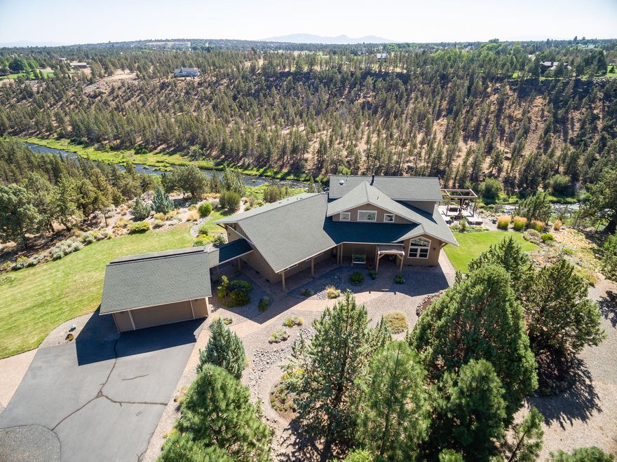 Overlooking the Deschutes River Canyon, this gorgeous Sun Forest-constructed home is graced by nature and scenic river views from every window. The 10-acre property is adjacent to BLM and features its own trail down to the river, landscaped fenced yard, gardens and extensive Trex decks. Vaulted ceilings with striking beams, Douglas fir built-ins, maple flooring and large open spaces maintains a streamlined architectural style throughout. The gorgeous kitchen features island seating and a casual dining area. Upstairs, the primary suite has impressive panoramic views, sitting area, luxury bath, and 2 walk-in closets. You'll spend most of your time watching the fluidity of the river and wildlife, never wanting to leave home.