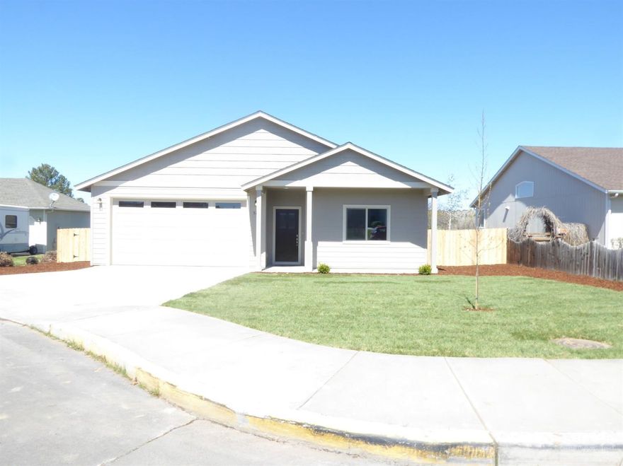 Brand new construction in Morning Crest Subdivision in Madras. This 1392 SF, 3 bedrooms, 2 bath home features 9'ceilings, natural gas furnace, hardiplank siding, attached double car garage with 8 foot garage door, front yard landscaped. Fenced back yard. Ready for you to move in. Great location, close to hospital and stores. Floor plan is mirror image.