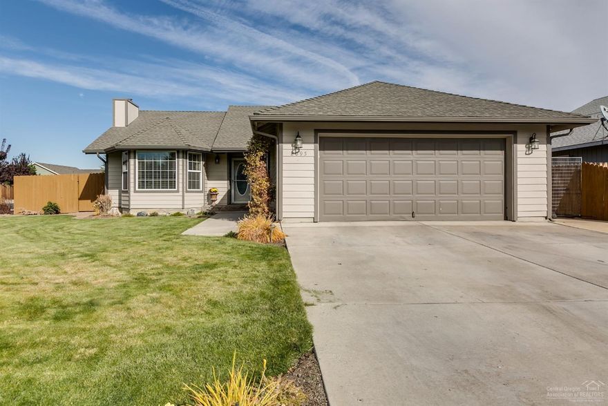Attractive home in an established NW Redmond neighborhood, this home is well appointed with thoughtful upgrades. Hickory hardwood floors, vaulted ceilings and a custom floor to ceiling rock faced fireplace surround. The kitchen features solid surface counter tops, full height tile back splash, stainless steel appliances and handsome oak cabinets. Situated on a large corner lot with RV parking, storage shed and a great back patio to entertain or relax to the ambiance provided by the custom water feature.